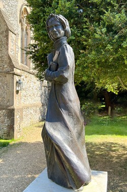 Statue of Jane Austen outside St. Nicholas Church, Chawton