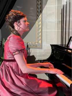 Laura Klein seated at the piano